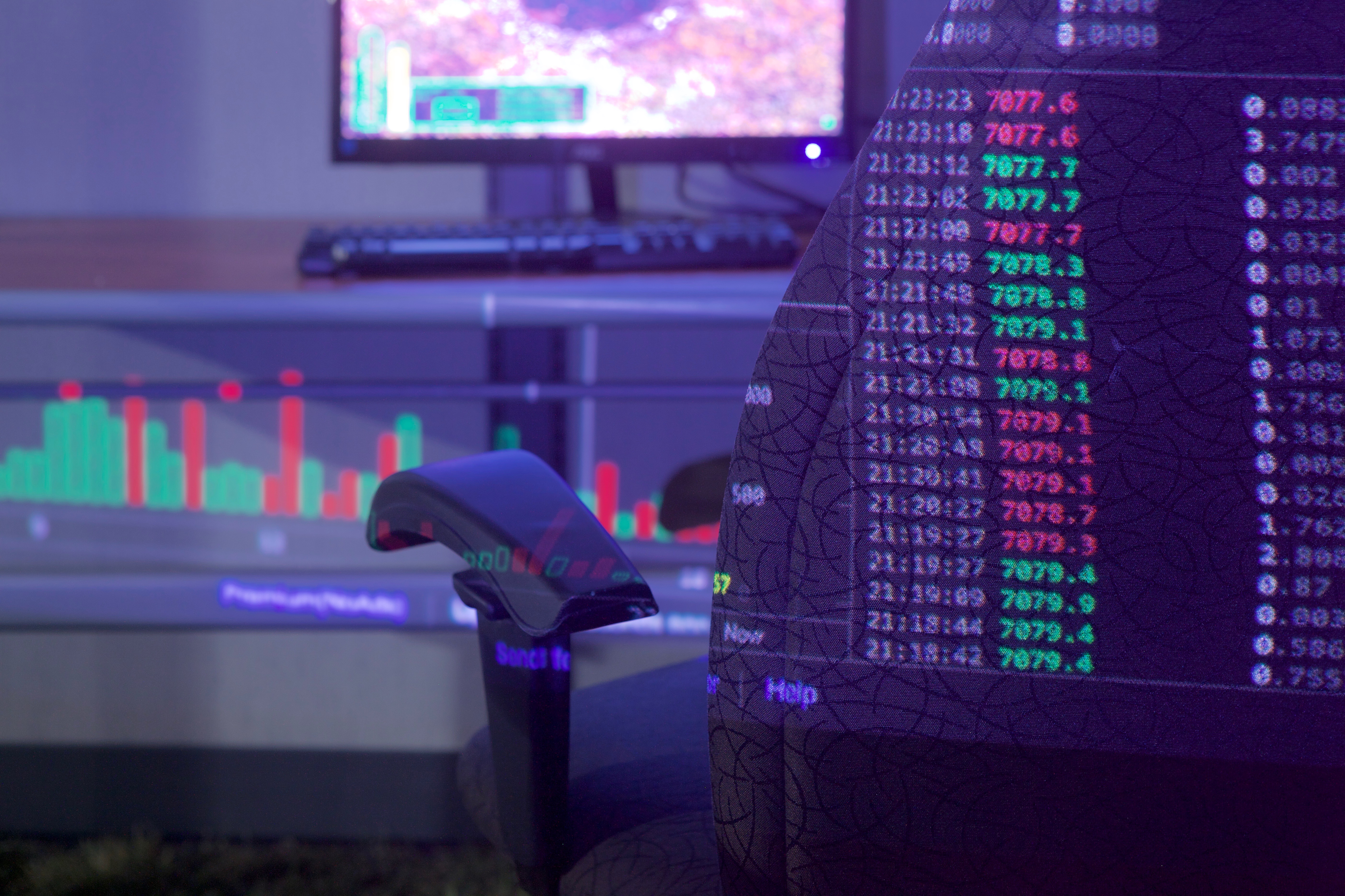 Close up of a ClickMine installation at The Brandscape in Toronto, showing bitcoin price chart projected onto an office chair